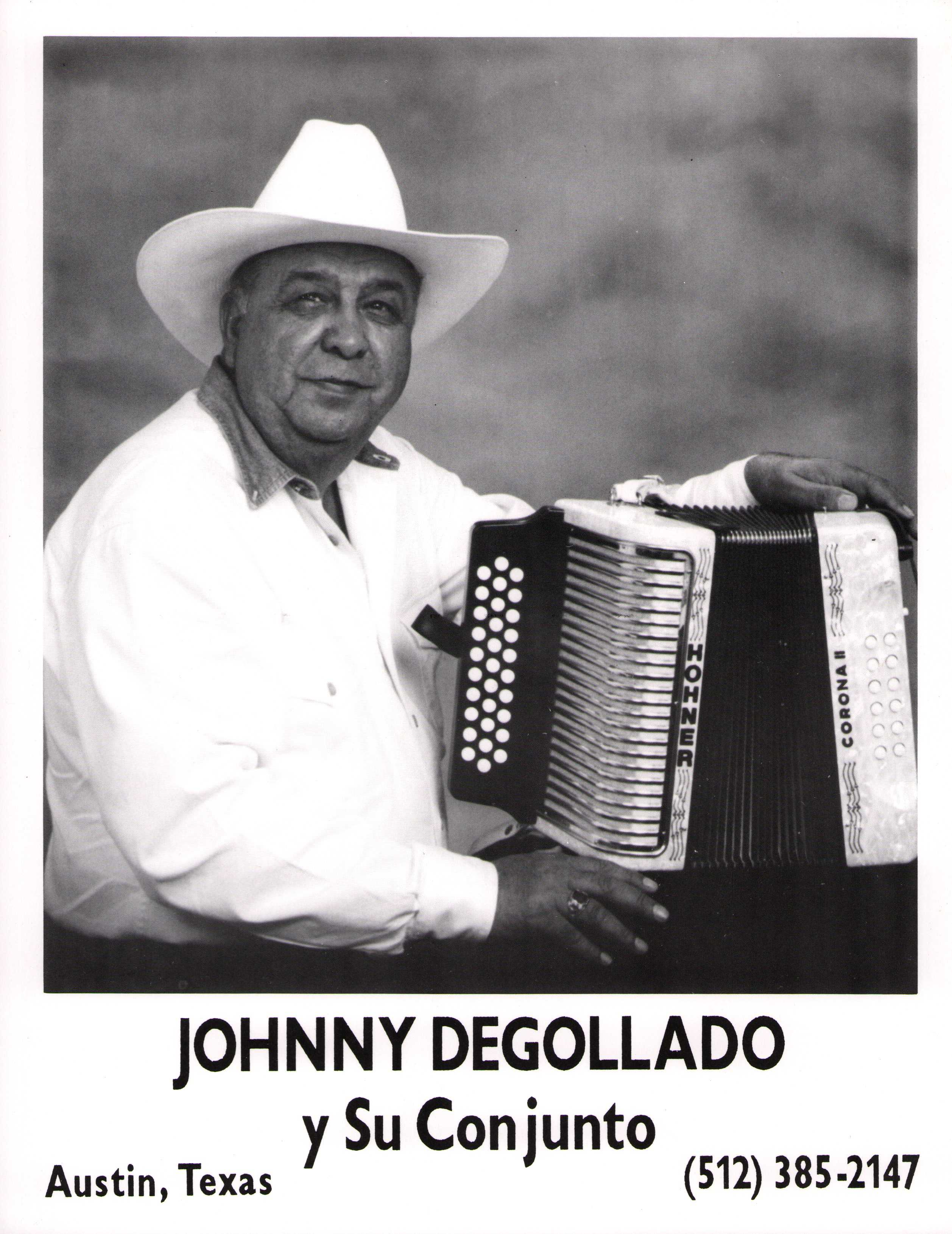 Johnny Degollado, wearing a cowboy hat and a white shirt, seated and holding an accordion.